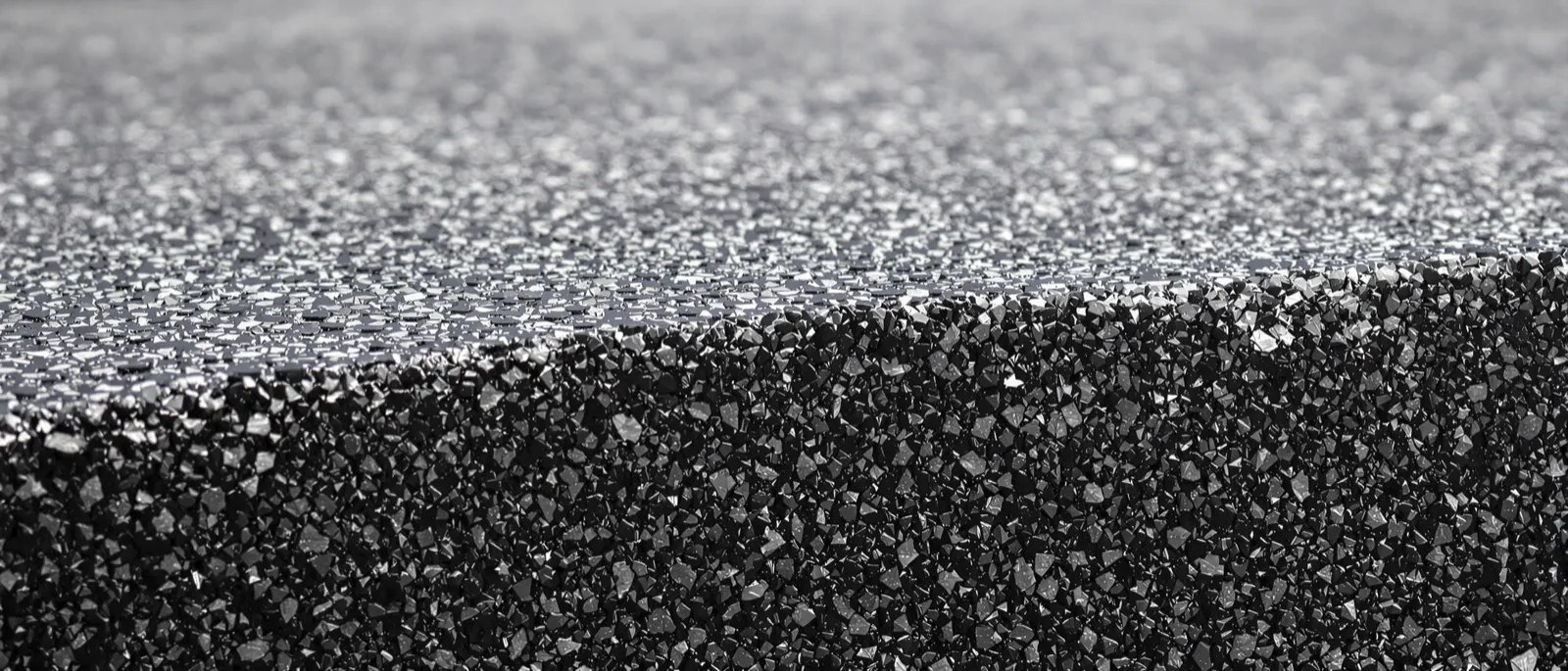 Heat shimmer rising off new asphalt at a busy Florida intersection under midday sun