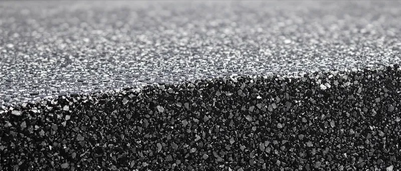 Heat shimmer rising off new asphalt at a busy Florida intersection under midday sun